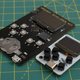 The Arduboy Mini next to the Arduboy Development Kit.